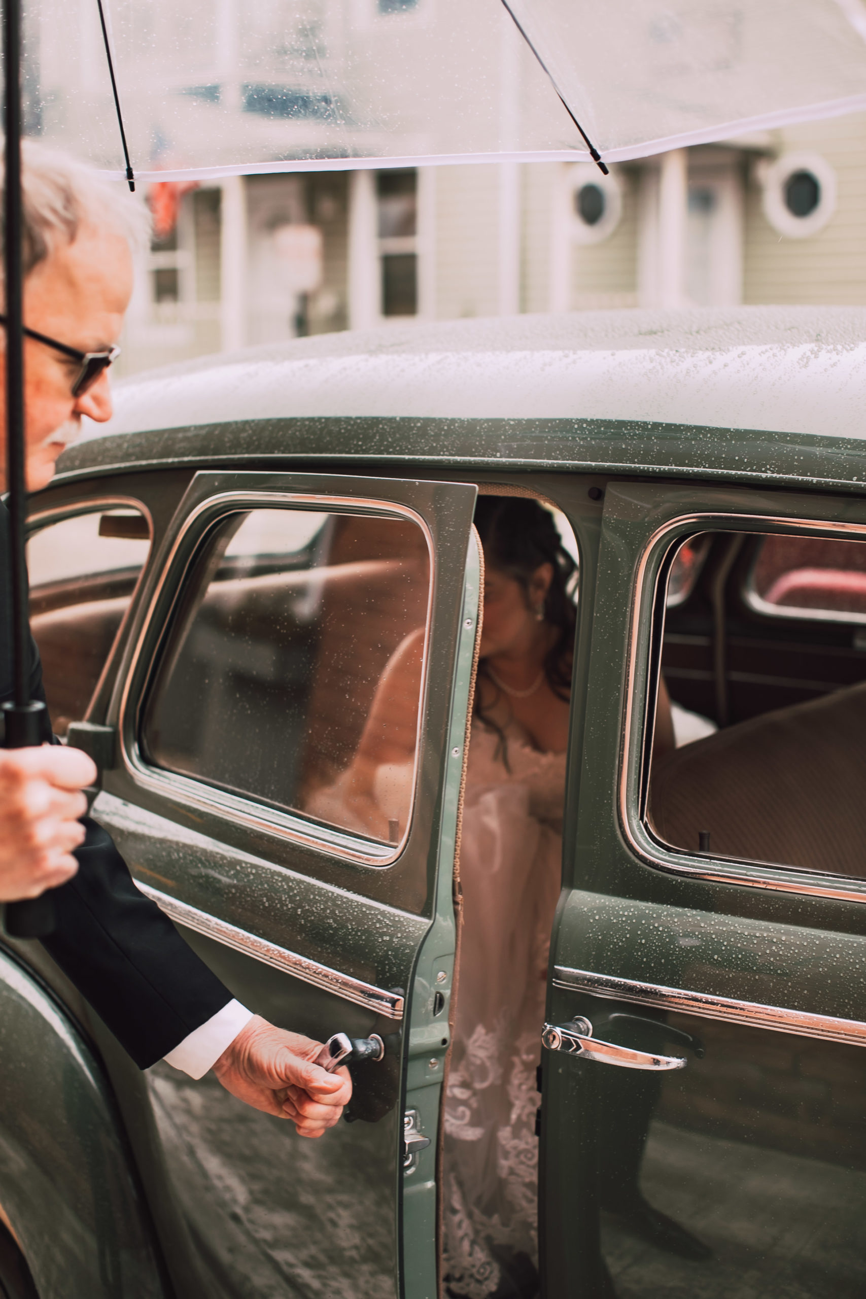 A bride gets out of a car